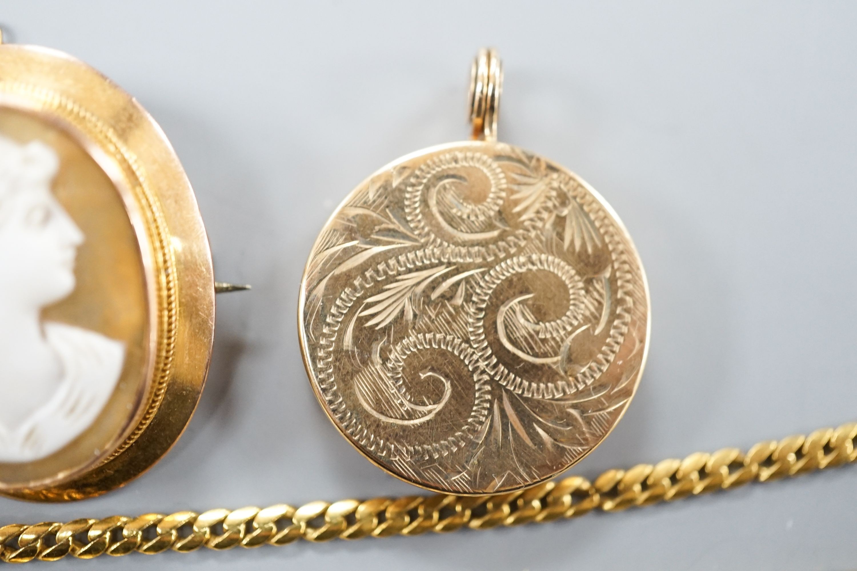 A 9ct gold 'serpent' necklet, 36cm, a 9ct mounted oval cameo shell brooch, a modern 9ct gold locket on a 9ct gold chain, gross 22.1 grams.